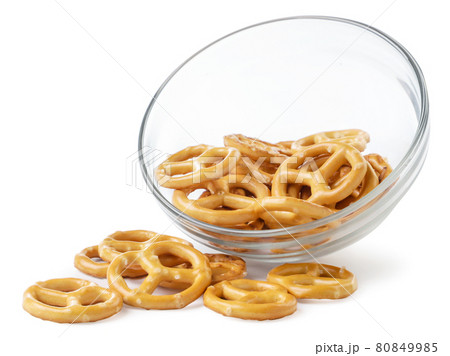 Pretzel spilling out of a plate on a white background, oktoberfest. Isolated Pretzel spilling out of a plate on a white background, oktoberfest. Isolated 80849985