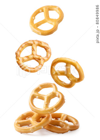 A pretzel falling on a white background, a pretzel levitating. Isolated A pretzel falling on a white background, a pretzel levitating. Isolated 80849986