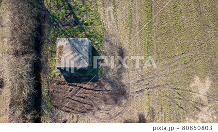 Aerial view from a drone of a brutalist cold gritty concrete world war two, ww2, pillbox war bunker Aerial view from a drone of a brutalist cold gritty concrete world war two, ww2, pillbox war bunker 80850803