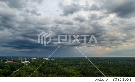 Aerial photo taken with a drone of a dark ominous grey storm clouds. Dramatic sky. lighting in dark Aerial photo taken with a drone of a dark ominous grey storm clouds. Dramatic sky. lighting in dark 80851052