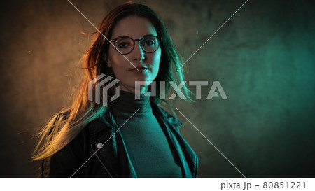 Strong colorful portrait shot of a young woman 80851221