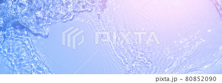 Serum texture close up. Light blue and pink gradient liquid gel background. Transparent beauty skincare sample. Cosmetic clear liquid cream smudge. Long banner with copy space. 80852090