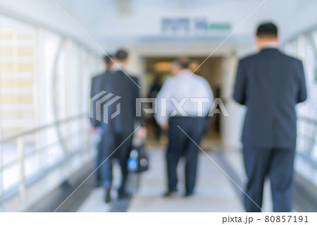 Blurred of people or Passengers walking in the modern building station. motion blur Blurred of people or Passengers walking in the modern building station. motion blur 80857191