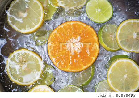 Summer drinks refreshing of cold drinks fresh fruit on ice bucket homemade cocktail tea with mojito lemon lime orange slice, summer drink juicy 80858495