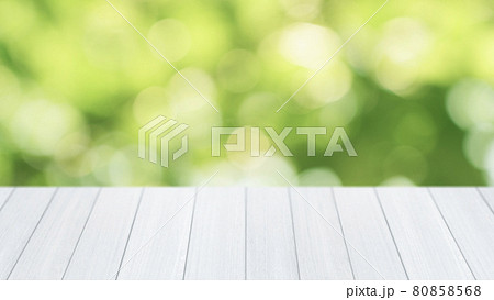 wood table top on green bokeh abstract background 80858568