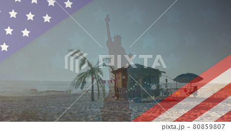 Image of american flag revealing statue of liberty and beach bar 80859807