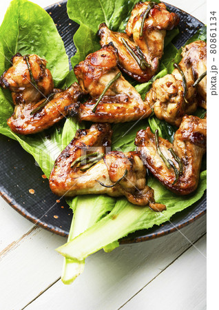 BBQ Chicken Wings on lettuce leaves BBQ Chicken Wings on lettuce leaves 80861134