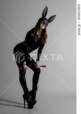 Sexy beautiful woman pole dancer posing in latex costum 80863869