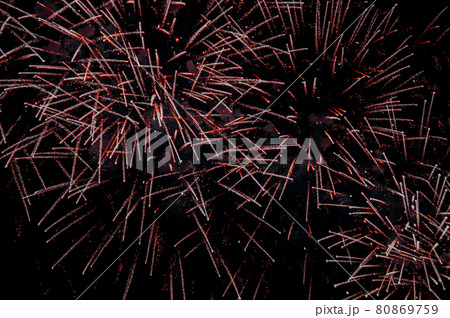 Fireworks exploding against the night sky 80869759