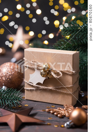 Winter composition with Christmas gift box and Christmas decorations. Winter composition with Christmas gift box and Christmas decorations. 80870160