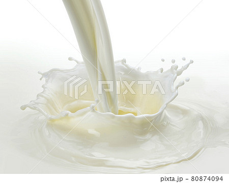 Pouring milk splash on white background Pouring milk splash on white background 80874094
