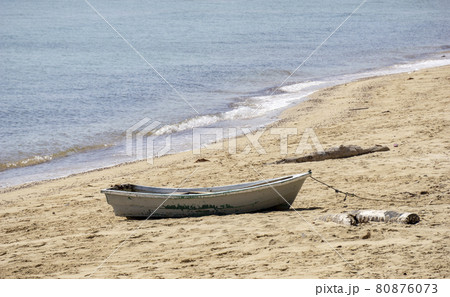 Small boat on the beach. Small boats on the beach Because the sea water decreases Sandy beach at Sairee Beach, Chumphon Province Small boat on the beach. Small boats on the beach Because the sea water decreases Sandy beach at Sairee Beach, Chumphon Province 80876073