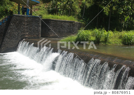river water flows in the tropical forest in Indonesia. this river is cool and beautiful. 80876951