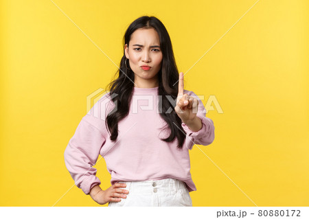 People emotions, lifestyle and fashion concept. Not so fast. Serious-looking confident asian girl denying something, shaking finger in disapproval, rejecting or prohibit offer People emotions, lifestyle and fashion concept. Not so fast. Serious-looking confident asian girl denying something, shaking finger in disapproval, rejecting or prohibit offer 80880172