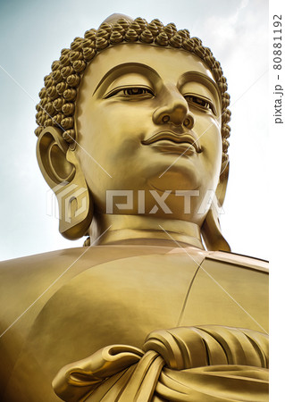 Giant golden buddha statue of Dhammakaya Thep Mongkol Buddha in construction site located at Wat Paknam Bhasicharoen temple Giant golden buddha statue of Dhammakaya Thep Mongkol Buddha in construction site located at Wat Paknam Bhasicharoen temple 80881192