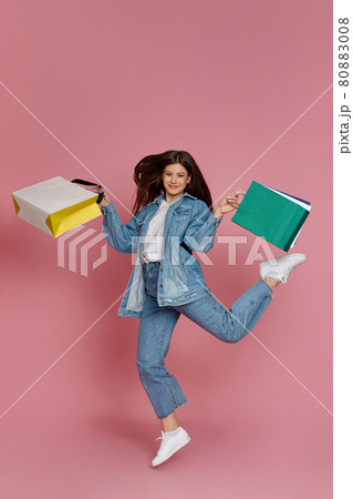 beautiful woman holding shopping bags with purchases beautiful woman holding shopping bags with purchases 80883008