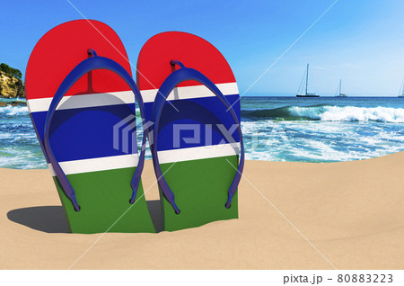 Flip flops with Gambia flag on the beach. Gambia resorts, vacation, tours, travel packages concept. 3D rendering 80883223