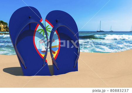 Flip flops with Guamanian flag on the beach. Guam resorts, vacation, tours, travel packages concept. 3D rendering Flip flops with Guamanian flag on the beach. Guam resorts, vacation, tours, travel packages concept. 3D rendering 80883237