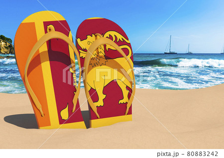 Flip flops with Sri Lankan flag on the beach. Sri Lanka resorts, vacation, tours, travel packages concept. 3D rendering Flip flops with Sri Lankan flag on the beach. Sri Lanka resorts, vacation, tours, travel packages concept. 3D rendering 80883242
