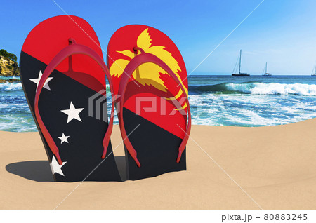Flip flops with Papuan flag on the beach. Papua New Guinea resorts, vacation, tours, travel packages concept. 3D rendering Flip flops with Papuan flag on the beach. Papua New Guinea resorts, vacation, tours, travel packages concept. 3D rendering 80883245