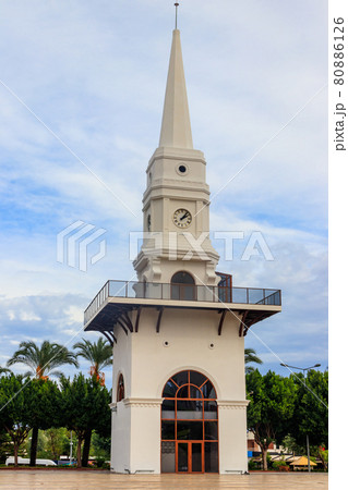 White clock tower in the center of Kemer, Antalya province, Turkey 80886126