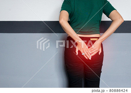 Incontinence problem,Hands woman holding her crotch,Female need to pee Incontinence problem,Hands woman holding her crotch,Female need to pee 80886424