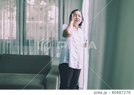 Mature asian elderly woman having a headache pain at home,Senior healthy concept Mature asian elderly woman having a headache pain at home,Senior healthy concept 80887276
