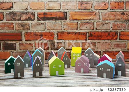 Colorful miniature house arranged on wooden background Colorful miniature house arranged on wooden background 80887539