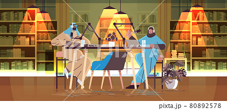 arab podcasters talking to microphones recording podcast in studio podcasting online radio broadcasting concept arab podcasters talking to microphones recording podcast in studio podcasting online radio broadcasting concept 80892578