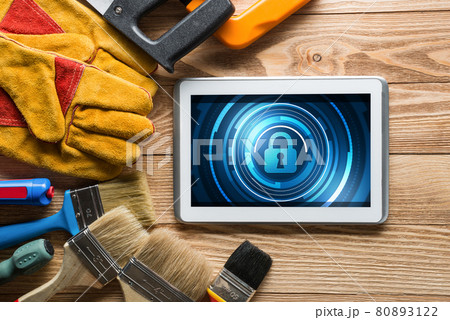 Web security and technology concept with tablet pc on wooden table Web security and technology concept with tablet pc on wooden table 80893122