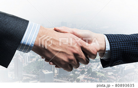 Close-up of the handshake of businessmen. Close-up of the handshake of businessmen. 80893635