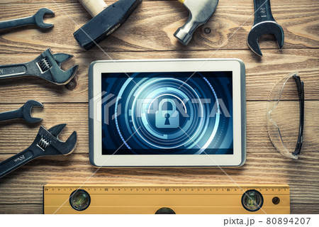 Web security and technology concept with tablet pc on wooden table 80894207