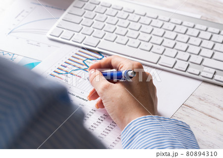 Investment manager analyze financial diagram 80894310
