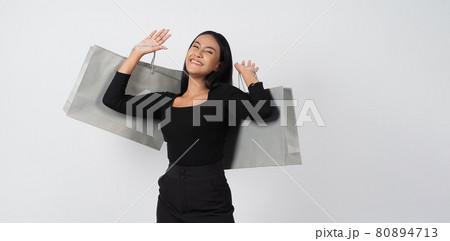 Love Shopping concept. Beautiful Asian woman carrying gray color bags shopping online. isolated on white studio background. online shopping bag. black hair woman love shopping online. Online purchase Love Shopping concept. Beautiful Asian woman carrying gray color bags shopping online. isolated on white studio background. online shopping bag. black hair woman love shopping online. Online purchase 80894713