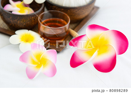 Set of spa treatments, natural oil, and plumeria flowers Set of spa treatments, natural oil, and plumeria flowers 80898289