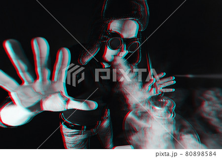 bearded man smokes a hookah and exhales a cloud of smoke 80898584