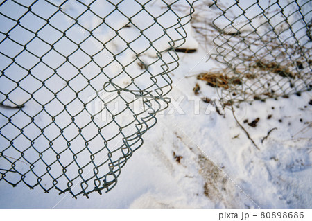 Hole in wire border fence. Hole in wire border fence. 80898686