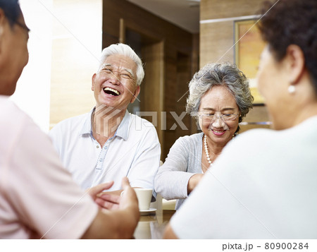 senior asian people getting together and having a good time 80900284