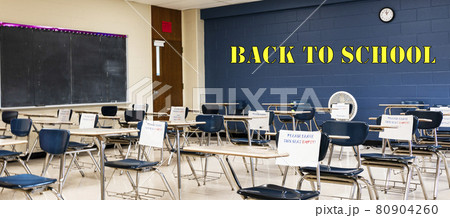 High school classroom desks with back to school written on the wall 80904260