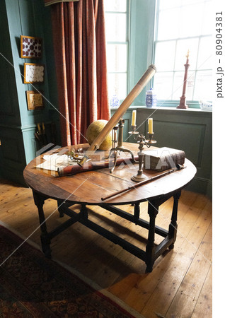 Hartlepool, U.K - July 27, 2021: The National Museum of The Royal Navy , in the North of England. Vintage library with old books and writting table Hartlepool, U.K - July 27, 2021: The National Museum of The Royal Navy , in the North of England. Vintage library with old books and writting table 80904381