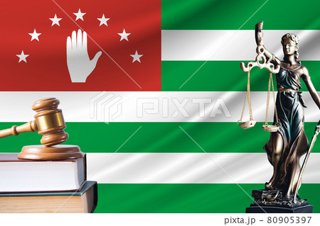 Law and justice in Abkhazia. Statue of themis and the gavel of the judge against the background of the flag of Abkhazia. Law and justice concept 80905397