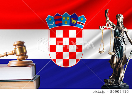 Law and justice in Croatia. Statue of themis and the gavel of the judge against the background of the flag of Croatia. Law and justice concept Law and justice in Croatia. Statue of themis and the gavel of the judge against the background of the flag of Croatia. Law and justice concept 80905416