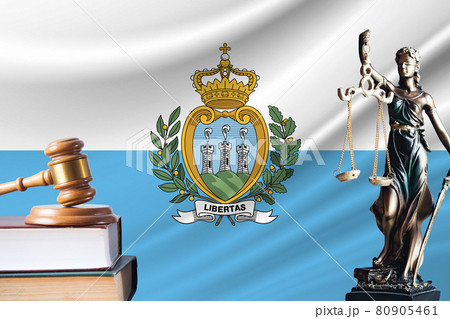 Law and justice in San Marino. Statue of themis and the gavel of the judge against the background of the flag of San Marino. Law and justice concept 80905461
