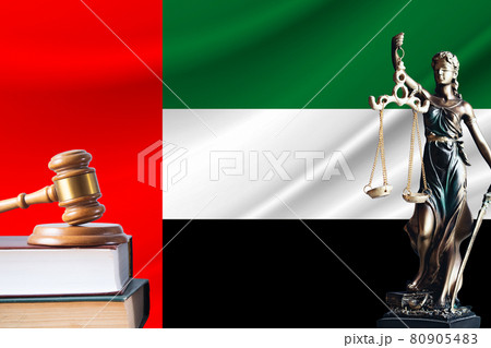 Law and justice in United Arab Emirates. Statue of themis and the gavel of the judge against the background of the flag of United Arab Emirates. Law and justice concept Law and justice in United Arab Emirates. Statue of themis and the gavel of the judge against the background of the flag of United Arab Emirates. Law and justice concept 80905483