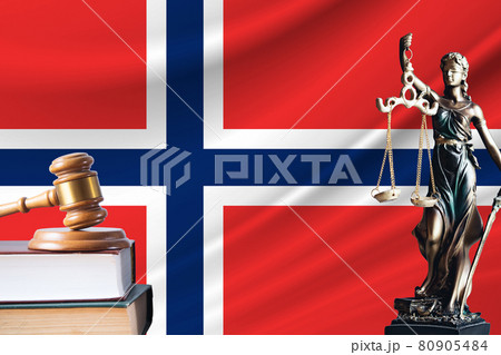 Law and justice in Norway. Statue of themis and the gavel of the judge against the background of the flag of Norway. Law and justice concept Law and justice in Norway. Statue of themis and the gavel of the judge against the background of the flag of Norway. Law and justice concept 80905484