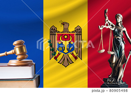 Law and justice in Moldova. Statue of themis and the gavel of the judge against the background of the flag of Moldova. Law and justice concept Law and justice in Moldova. Statue of themis and the gavel of the judge against the background of the flag of Moldova. Law and justice concept 80905498