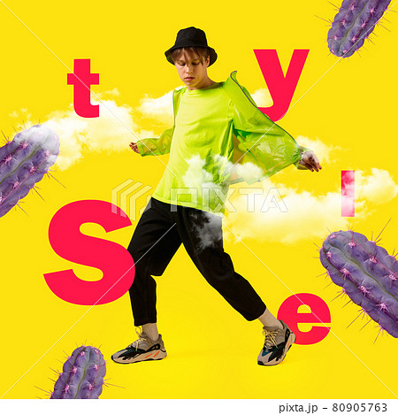 One young man in bright clothes and hat surrounded by cactus and letters. Minimal design 80905763