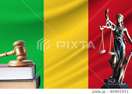 Law and justice in Mali. Statue of themis and the gavel of the judge against the background of the flag of Mali. Law and justice concept 80905931