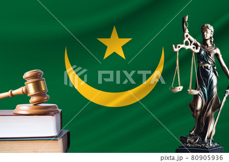 Law and justice in Mauritania. Statue of themis and the gavel of the judge against the background of the flag of Mauritania. Law and justice concept 80905936