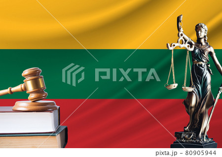 Law and justice in Lithuania. Statue of themis and the gavel of the judge against the background of the flag of Lithuania. Law and justice concept 80905944